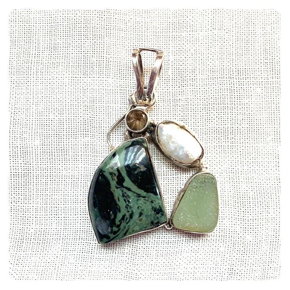 Semi-precious stone and sterling silver pendant.